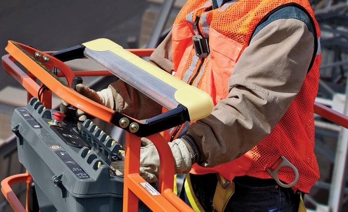 image of person standing on a boom lift